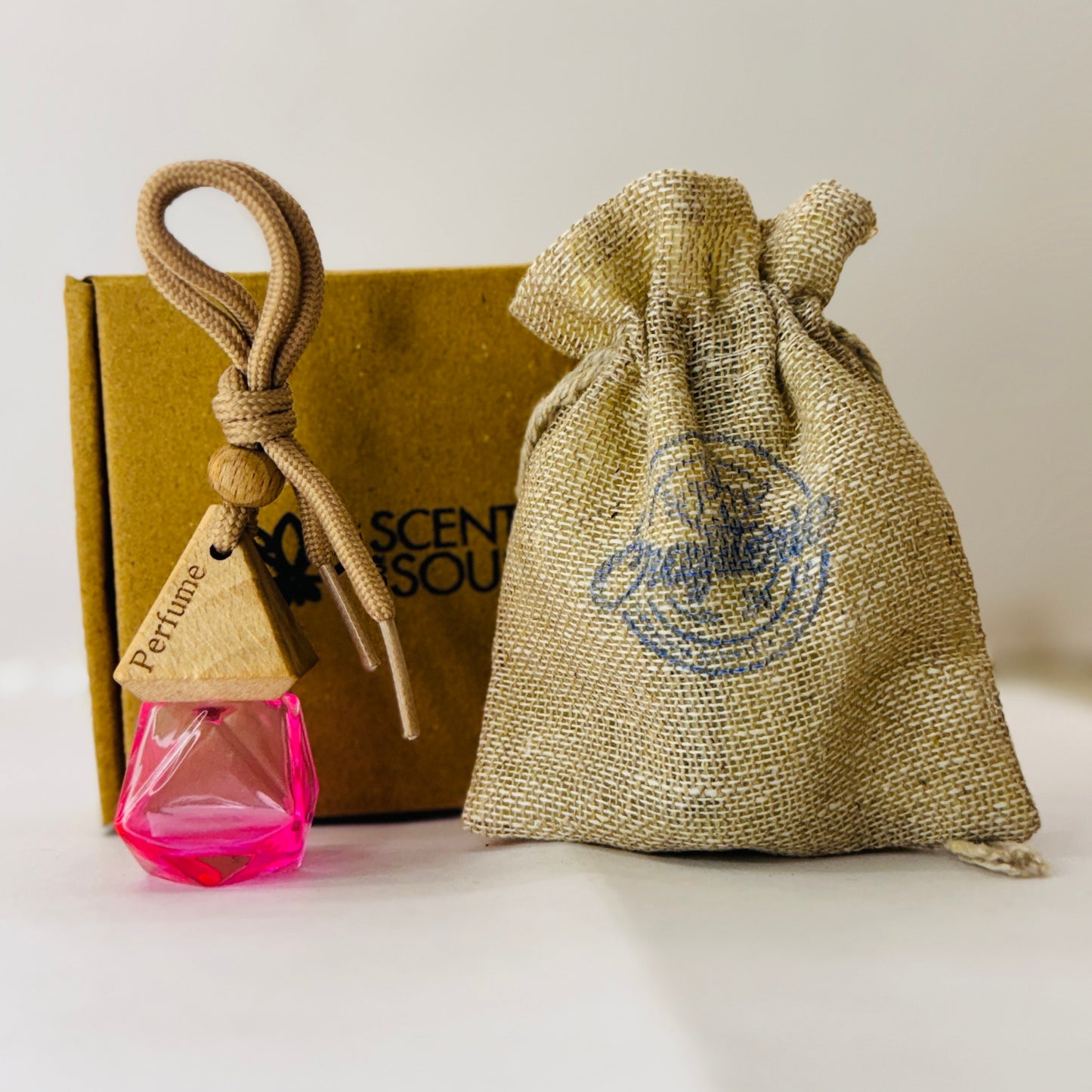 Car Air Freshener in Glass Bottle with Wooden Diffuser Lid - Pink Hanging Car Perfume with Jute bag and premium Box